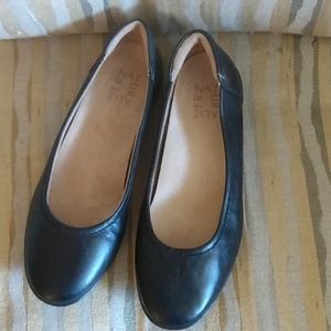 Black leather ballet style flats